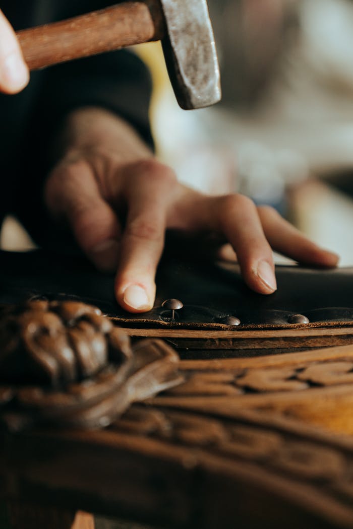 The Art of Drawing Readers In: Your attractive post title goes here Close-up of a craftsman working on vintage wooden furniture in a workshop setting.